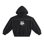 Studio Ruban black fleece hoodie with contrast stitching and a white 'S' logo graphic. Features a hood, front pocket, and oversized fit.