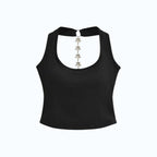 Studio Ruban black sleeveless halter neck crop top with a chain featuring star charms.