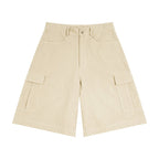 Studio Ruban Cruz Woven Cargo Shorts in Beige. Unisex, relaxed fit, mid-waist, cotton construction with multiple pockets.