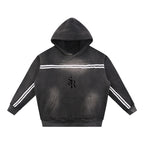 Studio Ruban oversized charcoal grey fleece hoodie with sun fade effect, contrast white stripes on chest and sleeves, and front pocket.