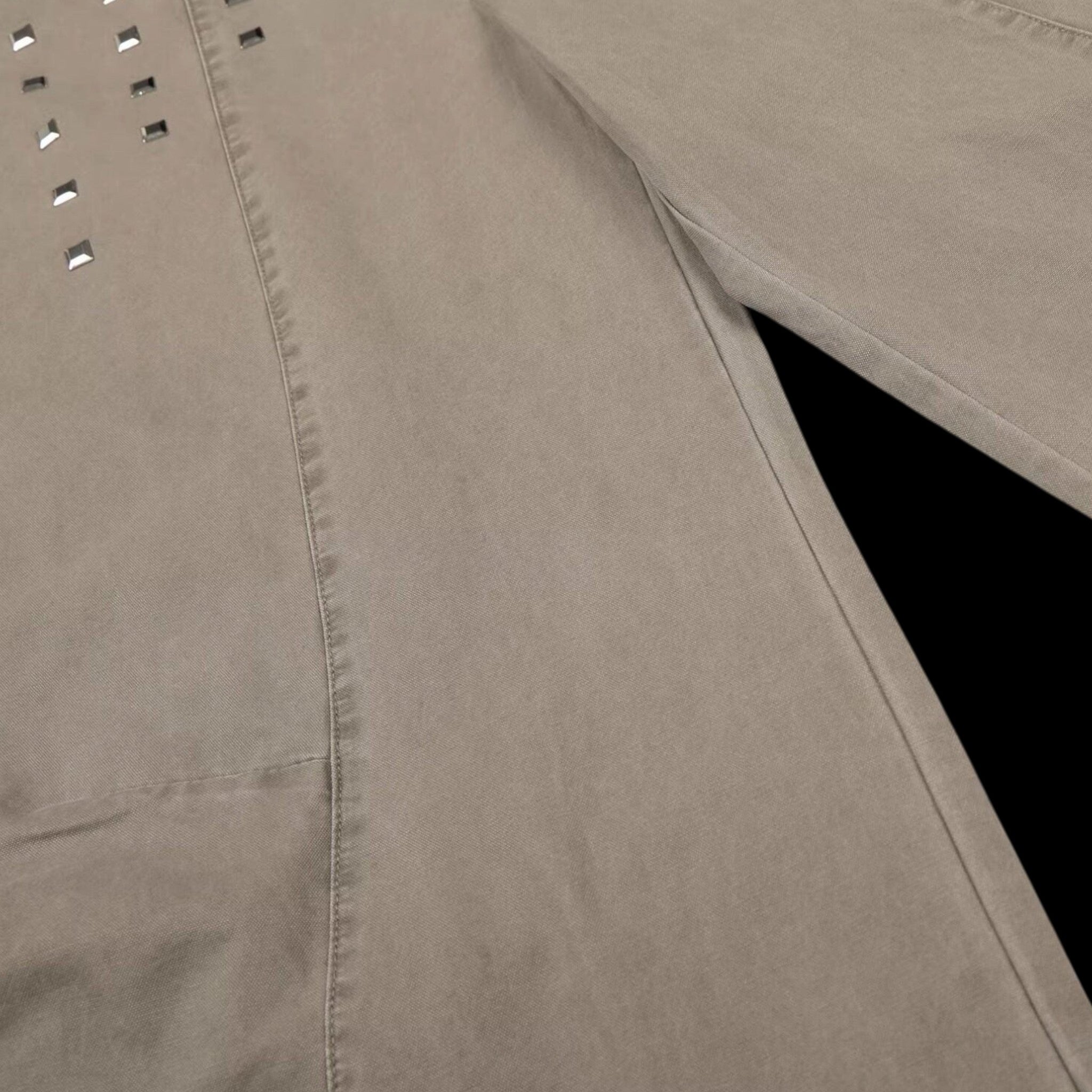 Studio Ruban Kisa taupe denim wide leg jeans with square stud embellishments and a relaxed fit.
