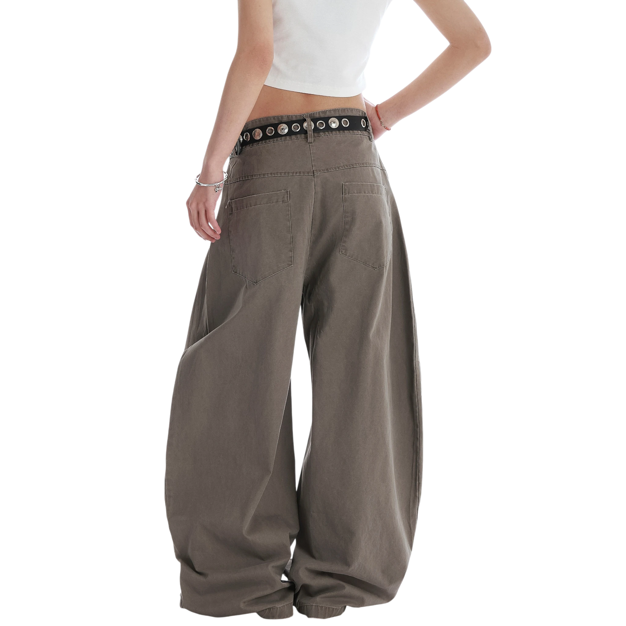 Studio Ruban Kisa taupe wide leg denim jeans with square stud embellishments and a black studded belt.