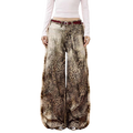 Studio Ruban Leo wide leg jeans in leopard print denim with a washed-out effect and a red belt.