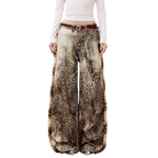 Studio Ruban Leo wide leg jeans in leopard print denim with a washed-out effect and a red belt.
