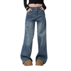 Studio Ruban mid-wash denim wide leg jeans with rhinestone embellishments on front pockets and legs.