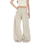 Studio Ruban Risa stone wide leg cargo pants with studded belt and exaggerated silhouette.