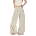 Studio Ruban Risa wide leg cargo pants in stone cotton blend with studded belt and utility pockets.