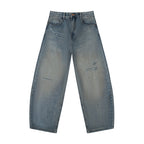 Studio Ruban Rux distressed barrel leg jeans in light blue washed denim with ripped detailing and a loose mid-waist.
