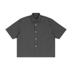 Studio Ruban charcoal grey short sleeve button-up shirt with thin white vertical pinstripes, lapel collar, and loose fit.