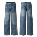 Studio Ruban Viola mid-wash denim wide leg jeans with rhinestone embellishments on front pockets and down the leg.