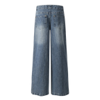 Studio Ruban Viola wide leg jeans in mid-wash denim with rhinestone embellishments on back pockets.