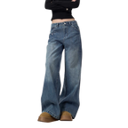 Studio Ruban Viola mid-wash denim wide leg jeans with rhinestone embellishments on pockets and legs.