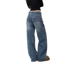 Studio Ruban Viola wide leg denim jeans with rhinestone embellishments on back pockets. Mid-wash blue denim.