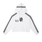 Studio Ruban white cropped hoodie with black side stripes and a Queen of Hearts graphic with "Beautiful Disaster" text.
