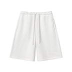 Studio Ruban white heavyweight fleece shorts with drawstring and pockets. Cotton blend fabric.